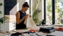 Craftswoman inspecting garment details in workshop