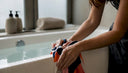 Hands rinsing swimwear in cool water