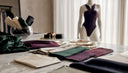 Minimalist boutique display with sustainable fabric samples