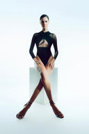 Front view of the Room 24 Liz black mesh bodysuit with crossover bust panels, sheer long sleeves and a diamond waist cut-out.