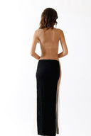 Back view of the Room 24 Madison black maxi dress highlighting its dramatic open back and illusion-mesh panels.