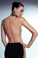 Back view of the Room 24 Madison black maxi dress highlighting its dramatic open back and illusion-mesh panels.