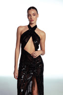 Front view of the Room 24 Iris black sequin lace maxi dress with a crossover halterneck, waist cut-out and thigh slit.