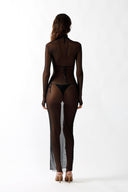 Back view of the Room 24 Renata black sheer dress showing its fitted long sleeves and flowing full-length silhouette.