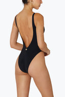 Back view of the Room 24 Layla swimsuit showing its wide straps and sculpted close-fitting silhouette.