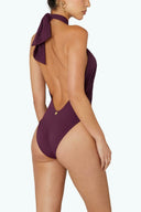 Side view of the Room 24 Carol one-piece highlighting its wrapped construction, open torso and sculpting fit.