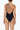 Back view of the Room 24 Louise swimsuit showing its open-back design, slim crossover straps and sculpted fit.