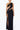 Front view of the Room 24 Joanna black maxi dress with a one-shoulder neckline, sweeping cut-outs and thigh-high split.
