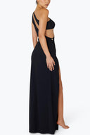 Side view of the Room 24 Joanna black maxi dress highlighting its curved waist cut-outs, body-contouring fit and high leg split.