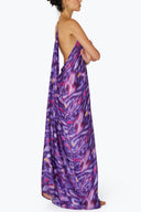 Side view of the Room 24 Raja printed maxi dress showing its low back, fluid fabric and relaxed full-length shape.