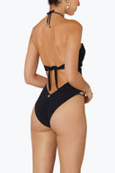 Back view of the Room 24 Alexa black swimsuit showing its halterneck fastening, open-back construction and sculpted fit.