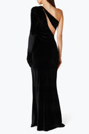 Back view of the Room 24 Verper black velvet dress showing its asymmetric shoulder construction and fitted full-length silhouette.