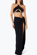 Front view of the Room 24 Sumie maxi skirt with a gathered waist, knotted detail and thigh-high slit.