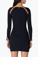 Back view of the Room 24 Becca black long-sleeve dress showing its sheer shoulder panels and sculpted mini silhouette.