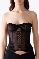 Front view of the Room 24 Selma corset with sheer tulle, underwired cups, lace appliqué and centre-front lacing.
