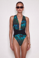 Front view of the Room 24 Rachel one-piece swimsuit with a deep plunge neckline, gathered panels and crossover waist.