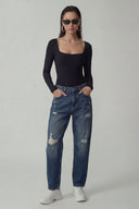 Front view of the Room 24 Jess black long-sleeve bodysuit with a square neckline and sculpted close fit.
