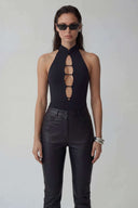 Front view of the Room 24 Lara black halterneck bodysuit with a high collar and vertical ladder-style chest cut-outs.