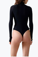 Back view of the Room 24 Kylie black long-sleeve bodysuit highlighting its fitted sleeves and streamlined thong silhouette.