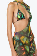 Side view of the Room 24 Muse mesh maxi dress showing its dramatic waist cut-out, sheer fabric and body-skimming fit.