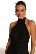 Close-up of the Room 24 Jovi black dress showing the high halterneck, tie fastening and lightweight sheer mesh.