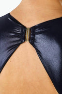 Close-up of the Room 24 Fanny one-piece swimsuit showing its plunge neckline and smooth stretch-fabric construction.