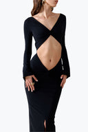 Front view of the Room 24 Bella black reversible maxi dress styled with a twisted V-neckline, curved waist cut-out and long sleeves.