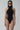 Room 24 Adela black high-neck bodysuit with curved mesh side panels and a sculpted fit.