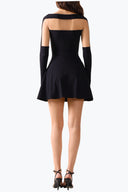 Back view of the Room 24 Sola black long-sleeve mini dress showing its sheer shoulder panel and defined A-line silhouette.
