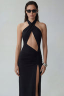 Front view of the Room 24 Astrid black cut-out dress with a crossover halterneck, ruched skirt and thigh-high split.