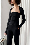 Side view of the Room 24 Alice trousers highlighting their fluid drape and full-length wide legs.