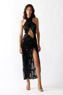 Front view of the Room 24 Iris black sequin lace maxi dress with a crossover halterneck, waist cut-out and thigh slit.