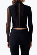 Back view of the Room 24 Joyce top showing its fitted cropped silhouette and contrasting sleeve construction.