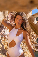 Front view of the Room 24 Alina one-piece swimsuit with an asymmetric neckline, gathered panel and sweeping waist cut-out.