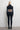 Back view of the Room 24 Anna black catsuit showing its cut-out shoulders, horizontal waist straps and fitted full-length legs.