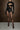 Front view of the Room 24 Ashanti black corset bodysuit with structured cups, a sheer boned waist and long glove sleeves.