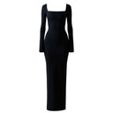 Close-up of the Room 24 Bella black dress showing its twisted neckline, smooth stretch fabric and reversible construction.