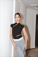 Front view of the Room 24 Rene black bodysuit with a Mandarin collar, cap sleeves and diagonal ladder cut-outs.