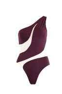 Close-up of the Room 24 Freya Bordeaux swimsuit showing its one-shoulder neckline, smooth stretch fabric and illusion-mesh detailing.