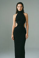 Front view of the Room 24 Camilla black halterneck maxi dress with sculpted waist cut-outs and a fitted silhouette.