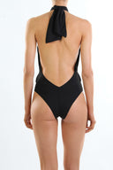 Back view of the Room 24 Carol swimsuit showing its halterneck construction, low back and close-fitting silhouette.