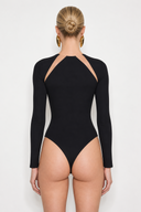 Back View of the Room 24 Katie black bodysuit with a sheer mesh neckline, angular shoulder cut-outs and long fitted sleeves.