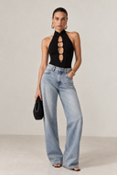 Front view of the Room 24 Lara black halterneck bodysuit with a high collar and vertical ladder-style chest cut-outs.