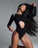 Side view of the Room 24 Selma black bodysuit highlighting its shoulder cut-outs, sculpting stretch fabric and high-cut leg.