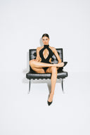 Front view of the Room 24 Adriana one-piece swimsuit with a high halterneck, plunging cut-outs and chain detailing.