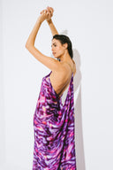Back view of the Room 24 Raja purple maxi dress highlighting its gold-tone chain straps and dramatic draped open back.