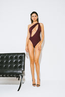 Front view of the Room 24 Louise one-piece swimsuit with an asymmetric neckline, sweeping cut-out and chain detailing.
