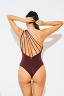 Back view of the Room 24 Louise swimsuit showing its open-back design, slim crossover straps and sculpted fit.