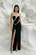 Side view of the Room 24 Eva black bodysuit showing its strapless shape, sheer mesh sections and sculpted close fit.