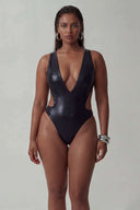Front view of the Room 24 Fanny one-piece swimsuit with a deep plunge neckline, curved waist cut-outs and high-cut legs.